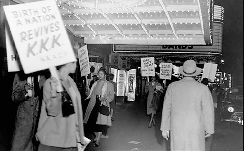 Protestors at a screening of The Birth of a Nation. “NAACP members picketing outside the Republic Theatre, New York City, to protest the screening of the movie “Birth of a Nation,” close-up view of demonstrators and sign reading “Birth of a Nation revives KKK,” 1947 (courtesy Library of Congress, Prints and Photographs Division, visual materials from the NAACP Records).