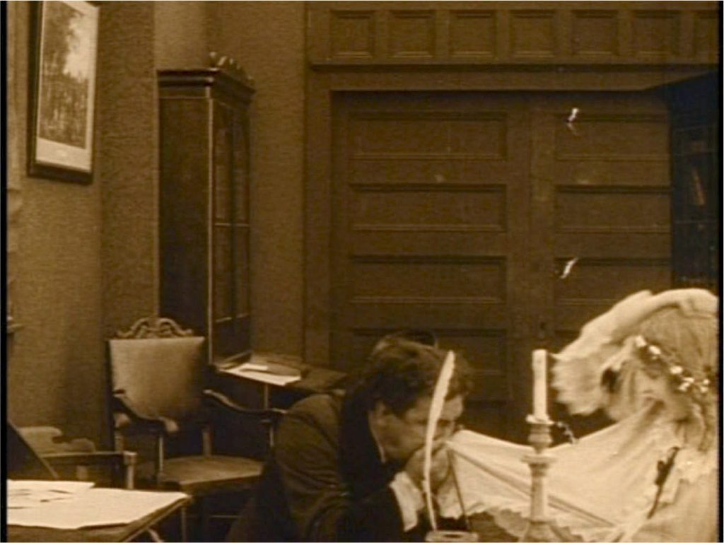 Elsie caught in the clutches of the mulatto Silas Lynch (screen capture by author).