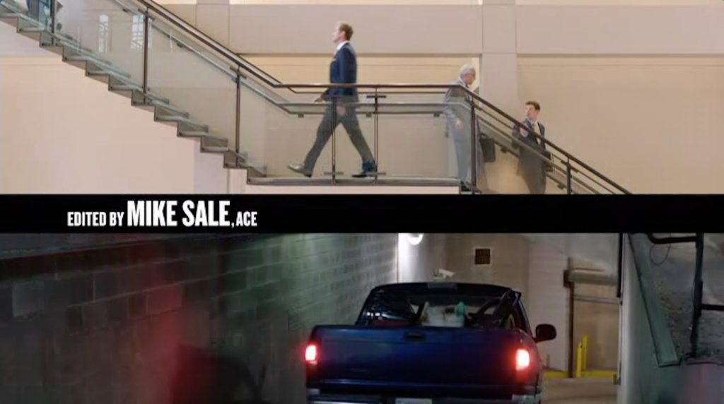 James King strides purposefully up the stairs while Darnell Lewis drives into the basement parking garage. The image reflects the film’s spatial articulation of racial hierarchy (screen capture by author).