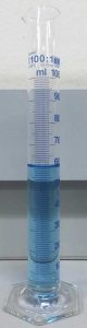 A 100 mL graduated cylinder graduated to every mL, with liquid to almost exactly 60 mL