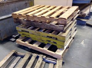 A pile of wooden pallets.