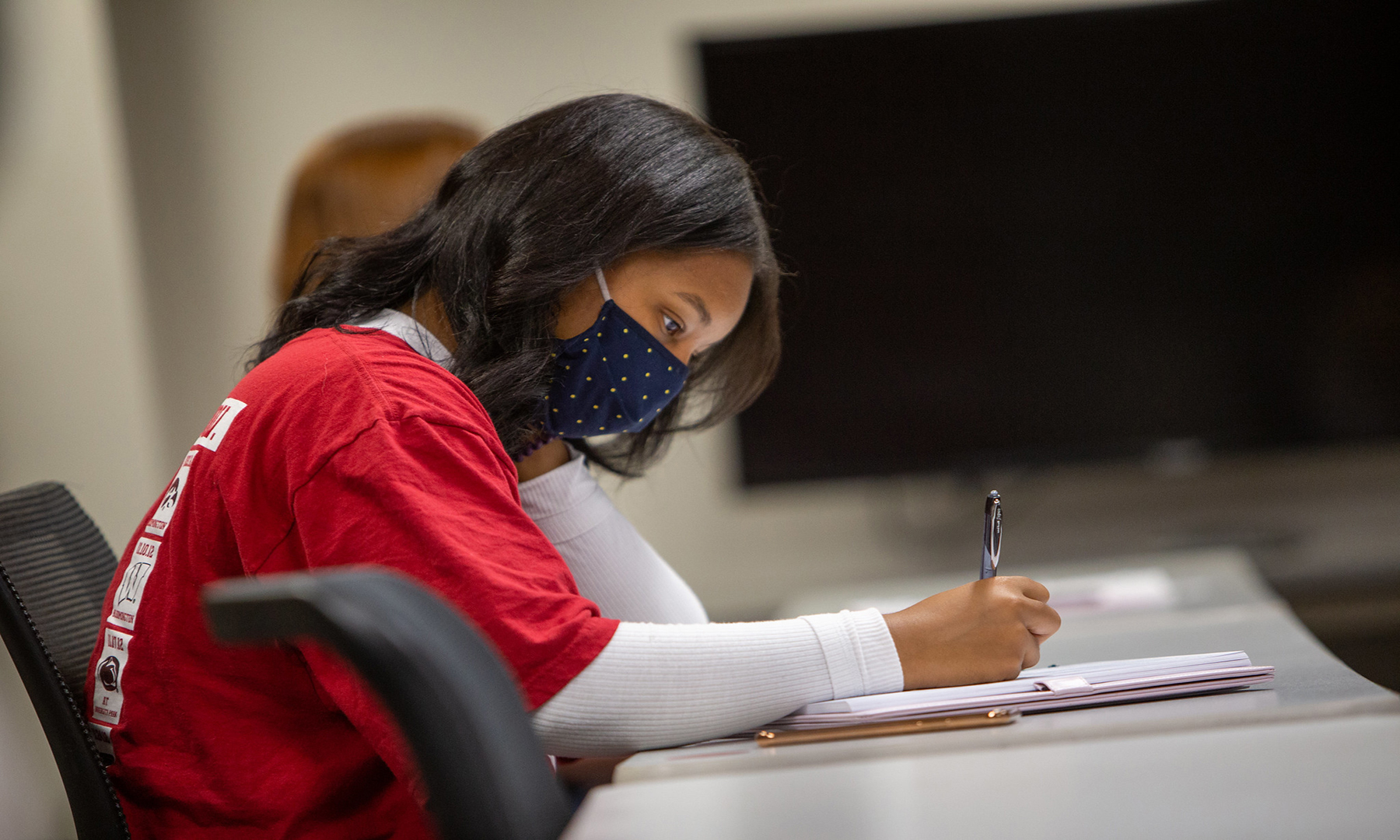 female student working at a desk