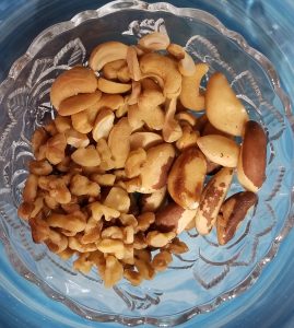 brazil nuts, cashews, and walnuts in a bowl