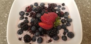 rice pudding with berries in a bowl