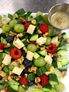 salad with raspberries, grapes, nuts, and cheese