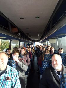 Photo of IU Southeast Concert Choir and IU Southeast Music Department faculty on a bus